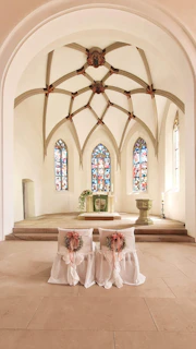 A peaceful church interior ready for the ordination ceremony, adorned with heartfelt decorations.