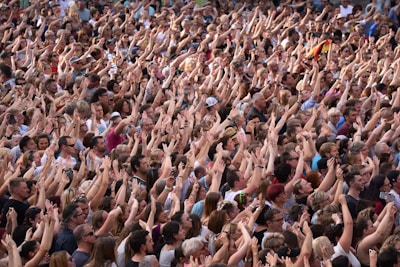 a large group of people standing in front of a crowd