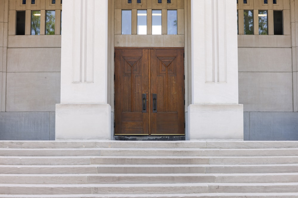 a couple of wooden doors sitting on top of a set of steps