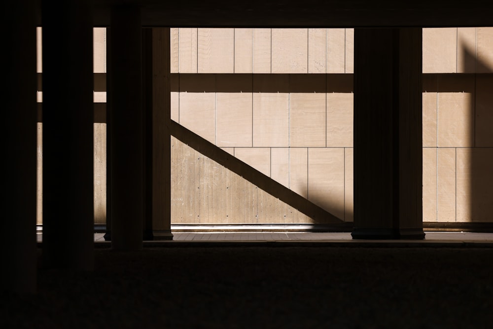 the shadow of a person standing in front of a wall