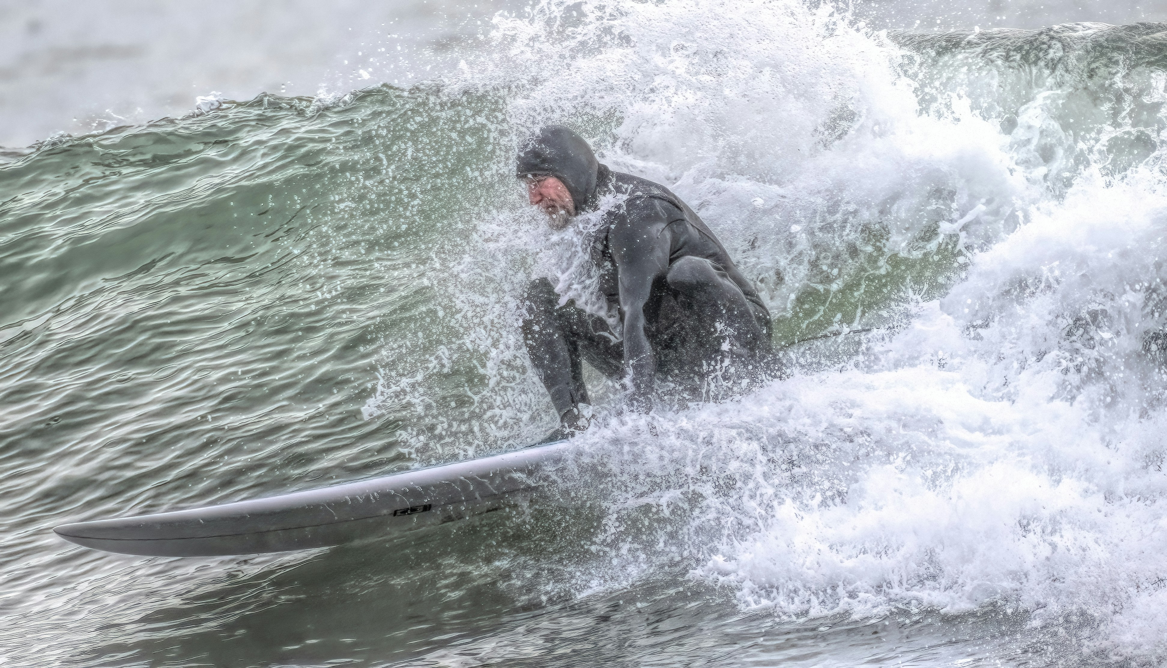 Man riding a surfboard on a wave