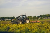 A Valtra tractor working on a farm.