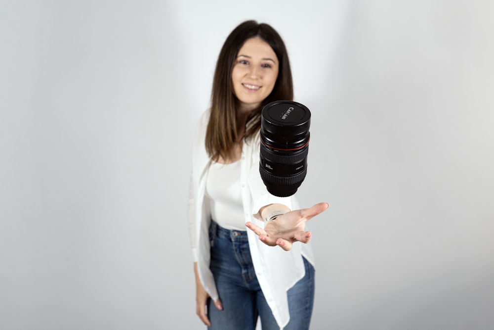 a woman holding a camera in her hands