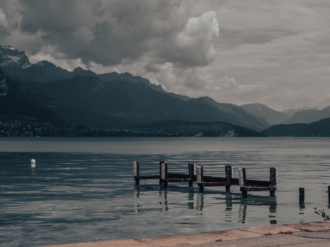 a body of water with mountains in the background,