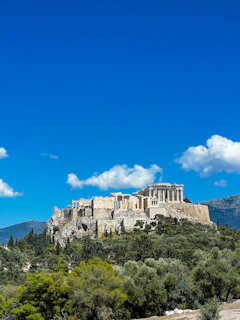 a view of the parthenon on top of a hill