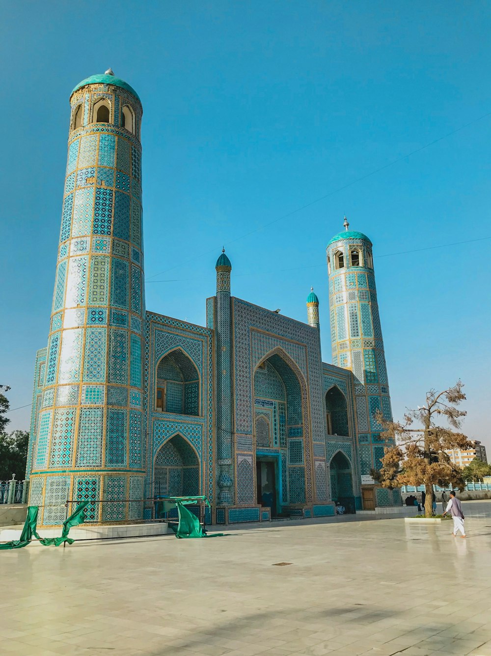 a large blue building with two towers on top of it