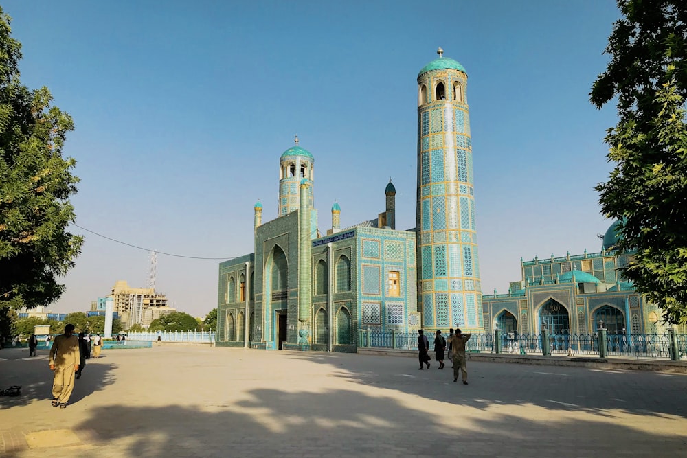 a large blue building with two tall towers