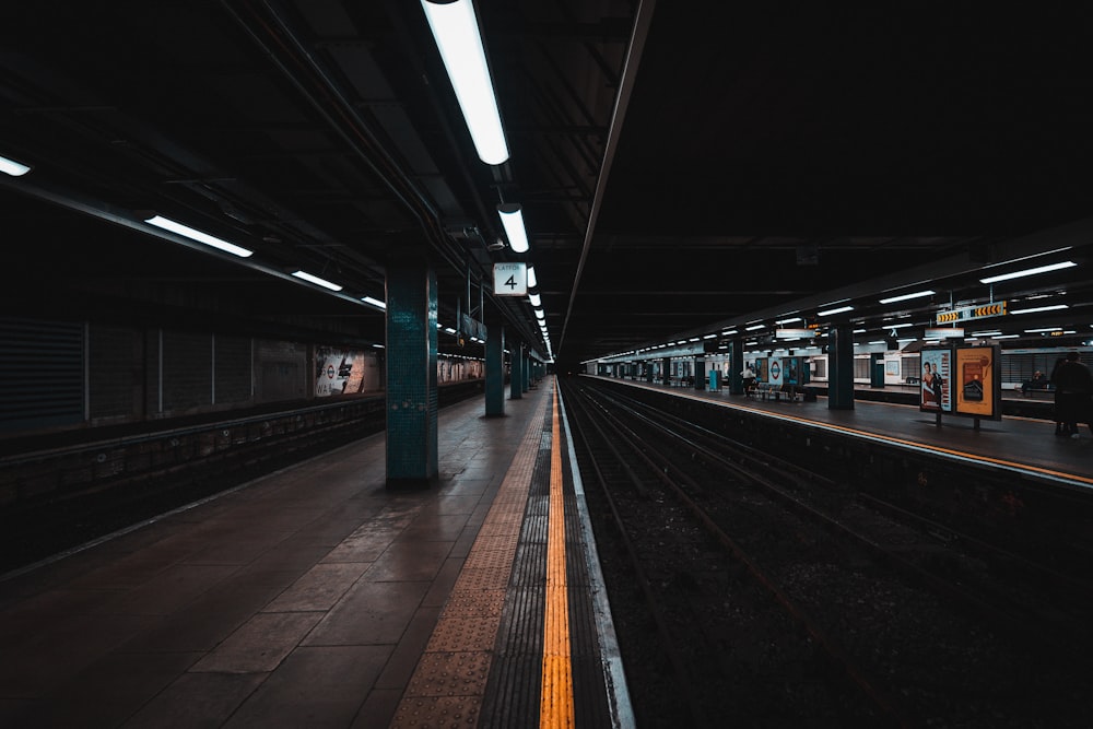 a train station with a train on the tracks