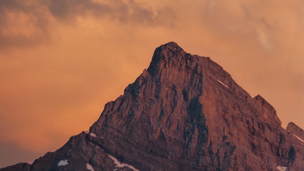 a very tall mountain with a sky background