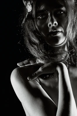 A powerful black-and-white portrait emphasizing the subject’s strength and grace.