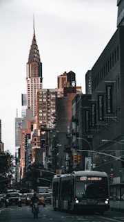 a city street filled with traffic and tall buildings