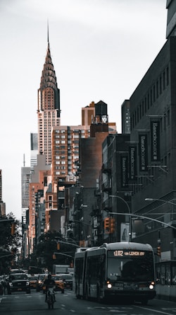 a city street filled with traffic and tall buildings