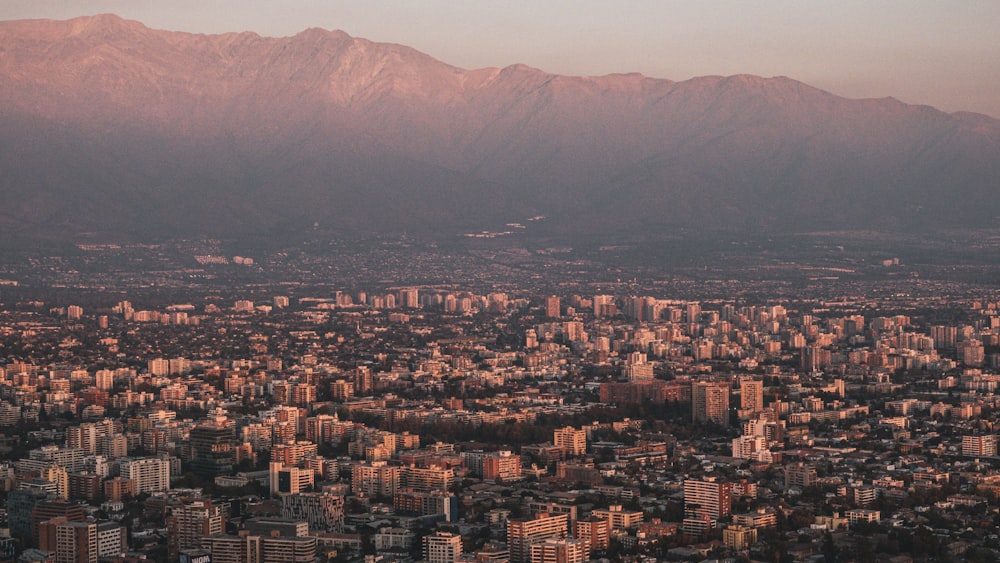 a view of a city with mountains in the background