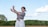 a woman is throwing a frisbee in a field