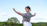a woman is throwing a frisbee in a field
