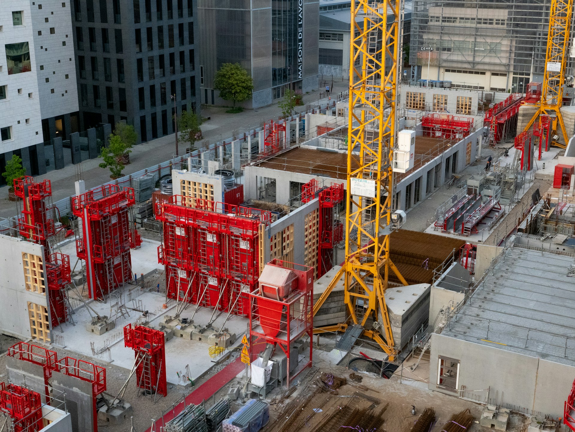 a construction site with a crane in the middle of it