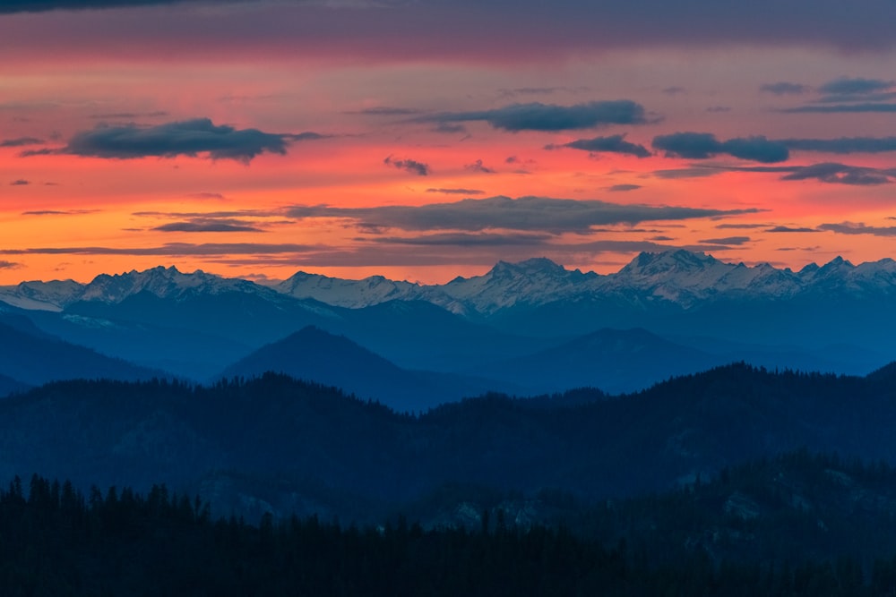 a view of a mountain range at sunset