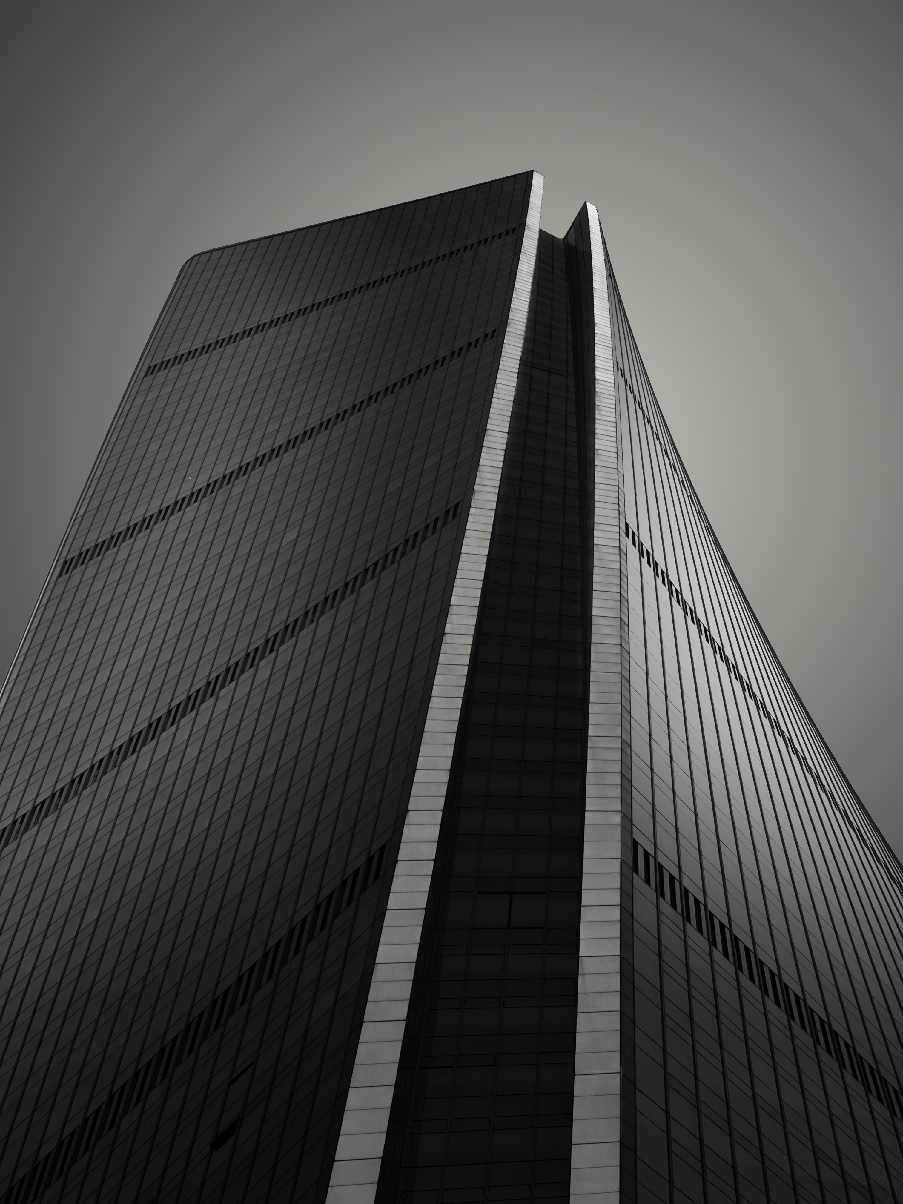 a black and white photo of a tall building