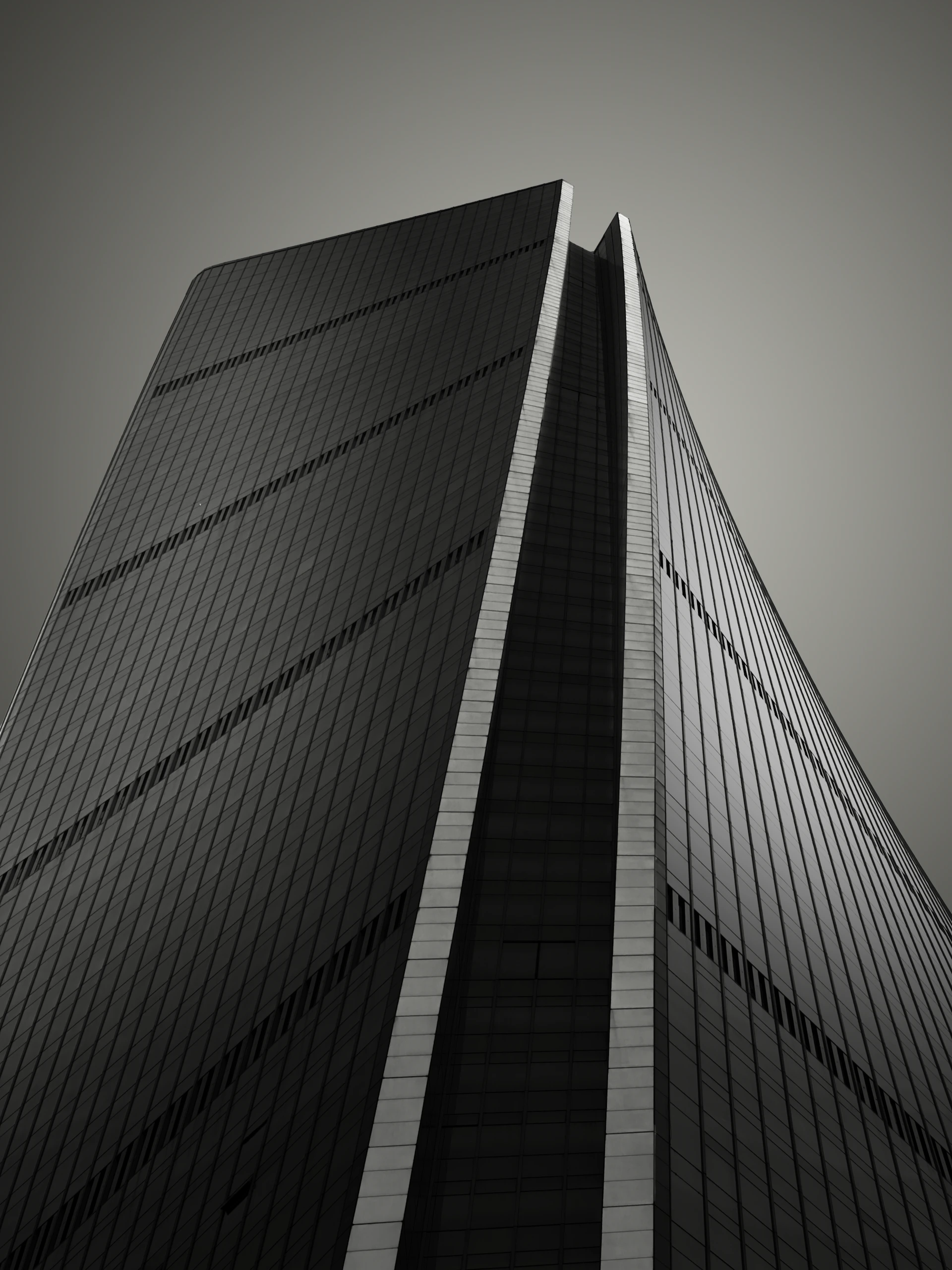a black and white photo of a tall building