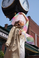 A casual-chic look with a lightweight trench coat and soft scarf, captured in natural light.
