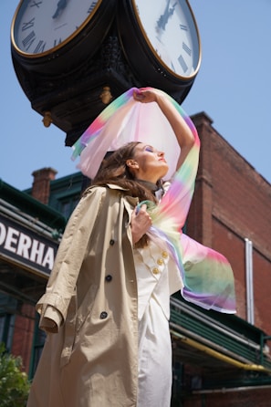 A casual-chic look with a lightweight trench coat and soft scarf, captured in natural light.