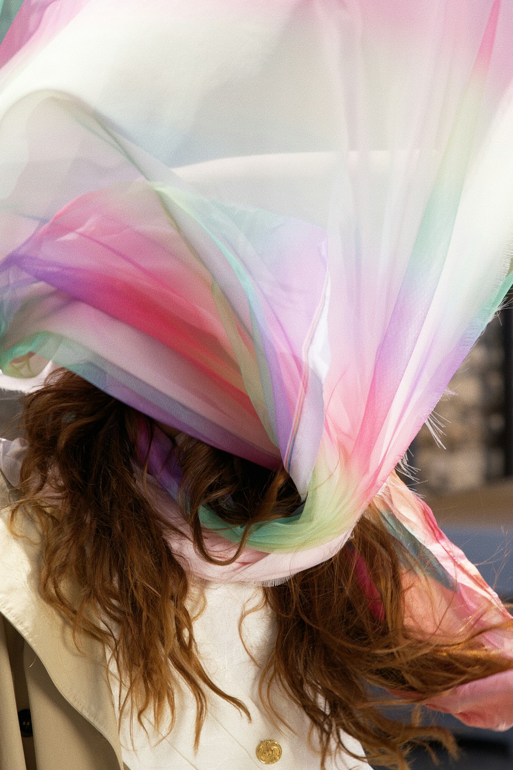 a woman with a colorful scarf on her head