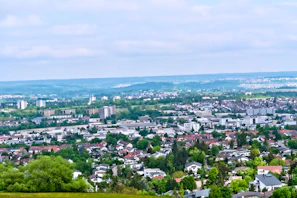 A panoramic view of a large lotissement with neatly arranged houses and green spaces