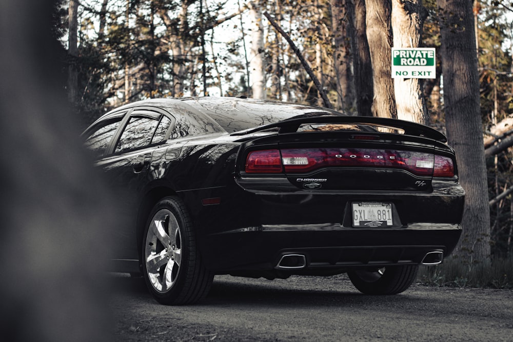 a black sports car parked on the side of the road