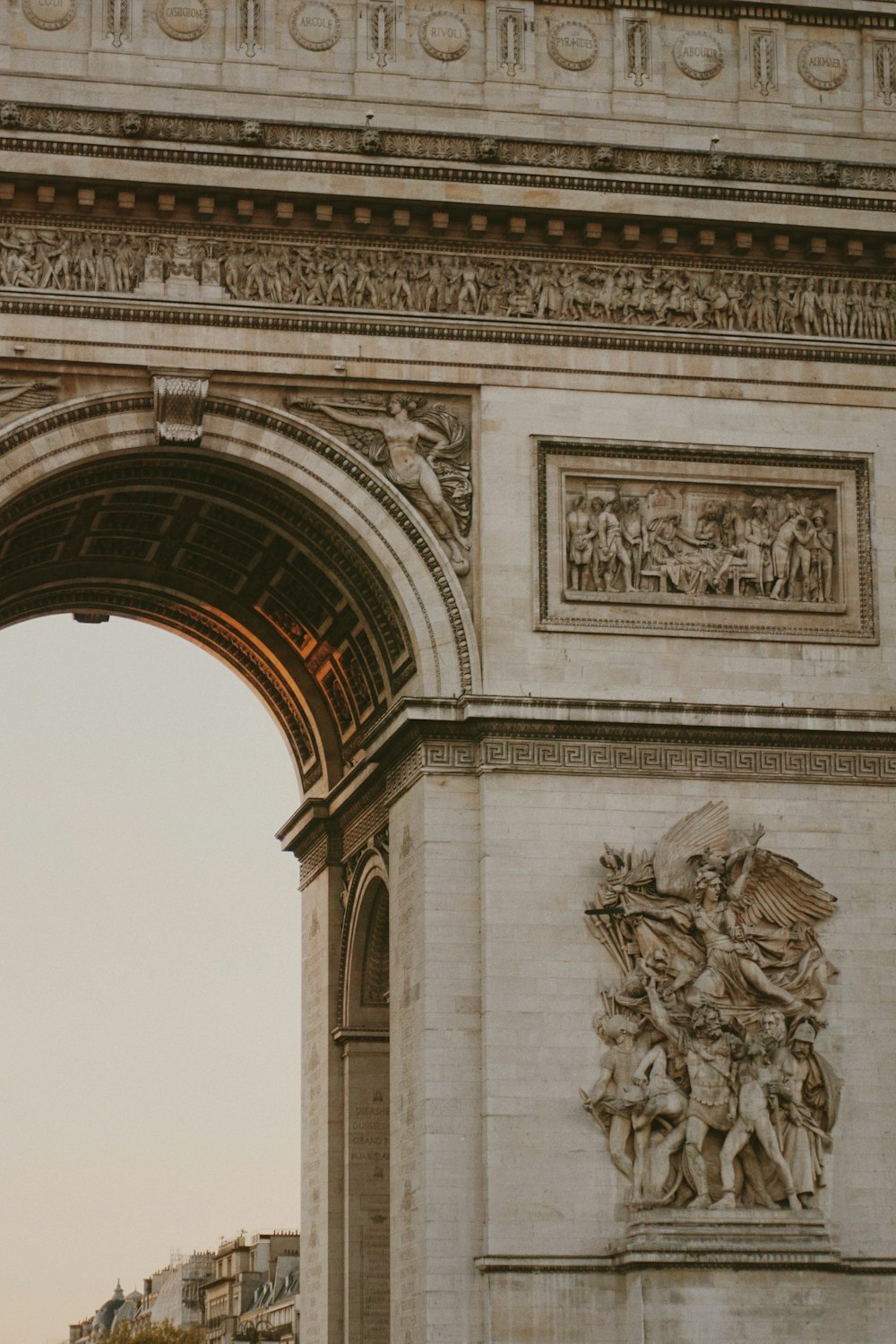 a large stone arch with a clock on top of it