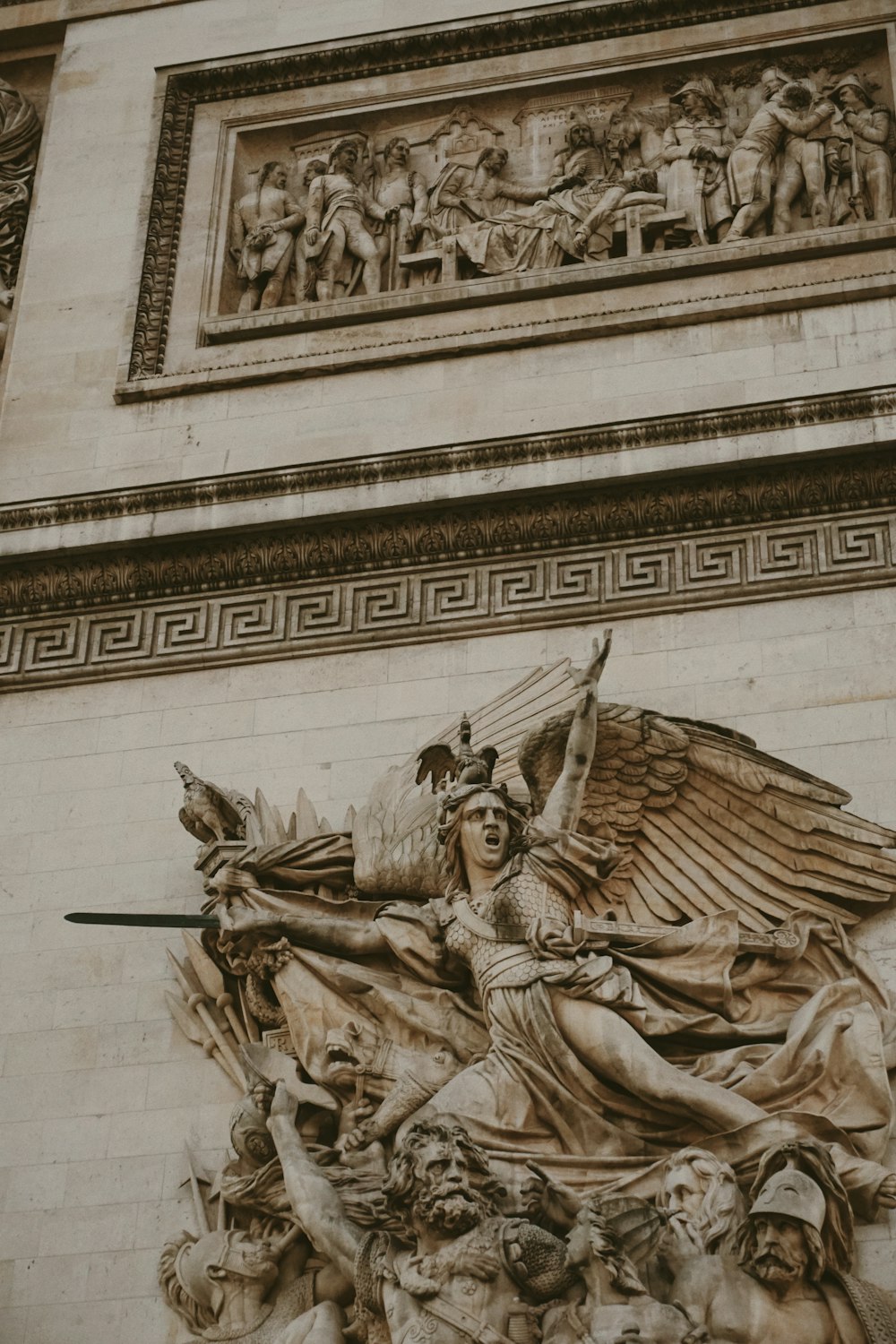 a statue on the side of a building