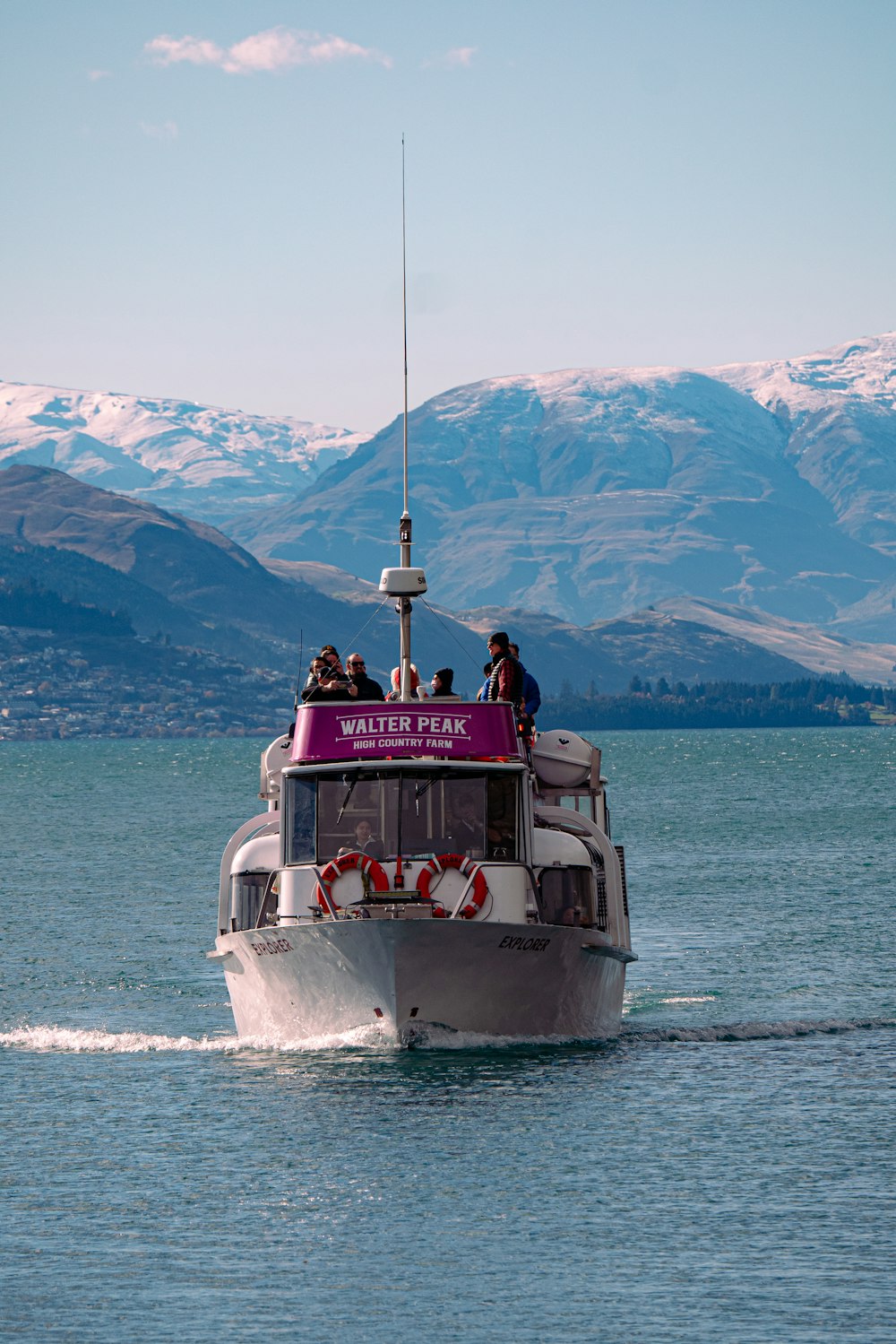 a boat with people on it in the water