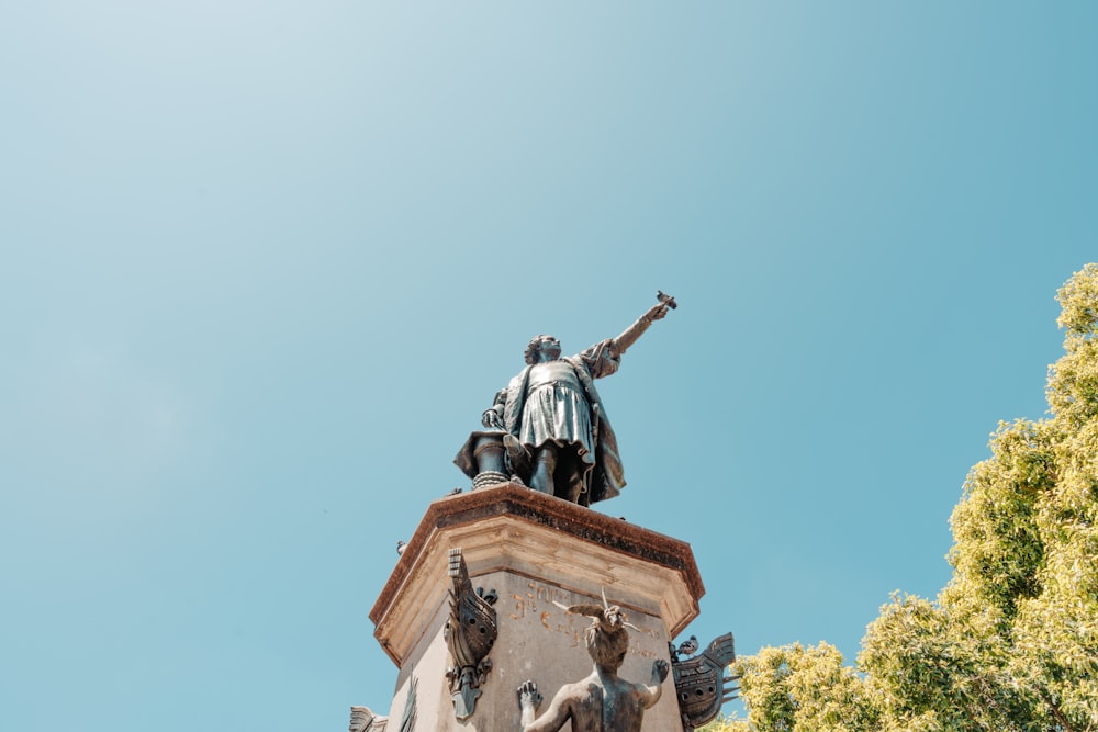 a statue of a man on top of a building