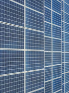 An assortment of solar inverters and mounting equipment laid out neatly.