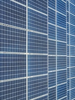 Technical blueprint overlay on a solar panel installation site, emphasizing system design.