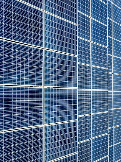 Photo of solar panels stacked and ready for shipment at a bustling Hong Kong warehouse.