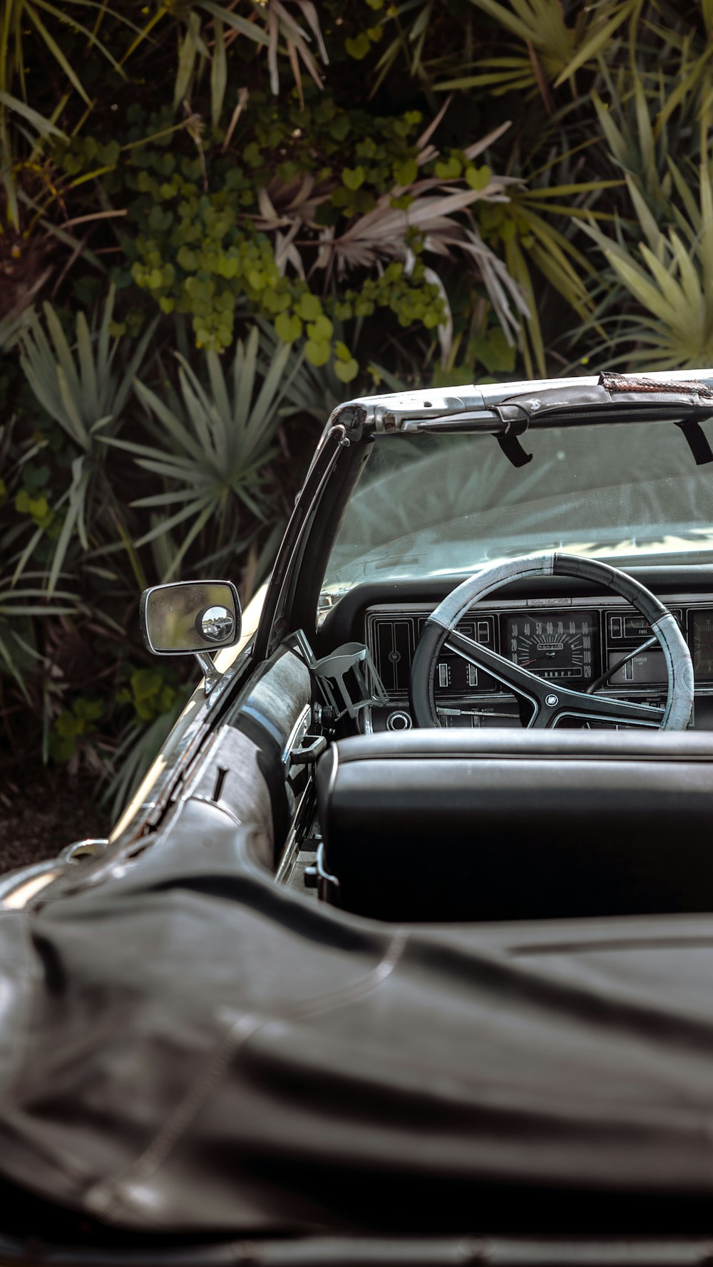 the interior of a car with a steering wheel and dashboard