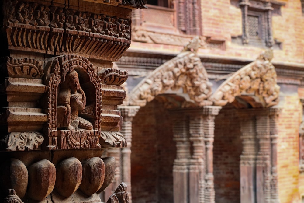 a close up of a building with carvings on it