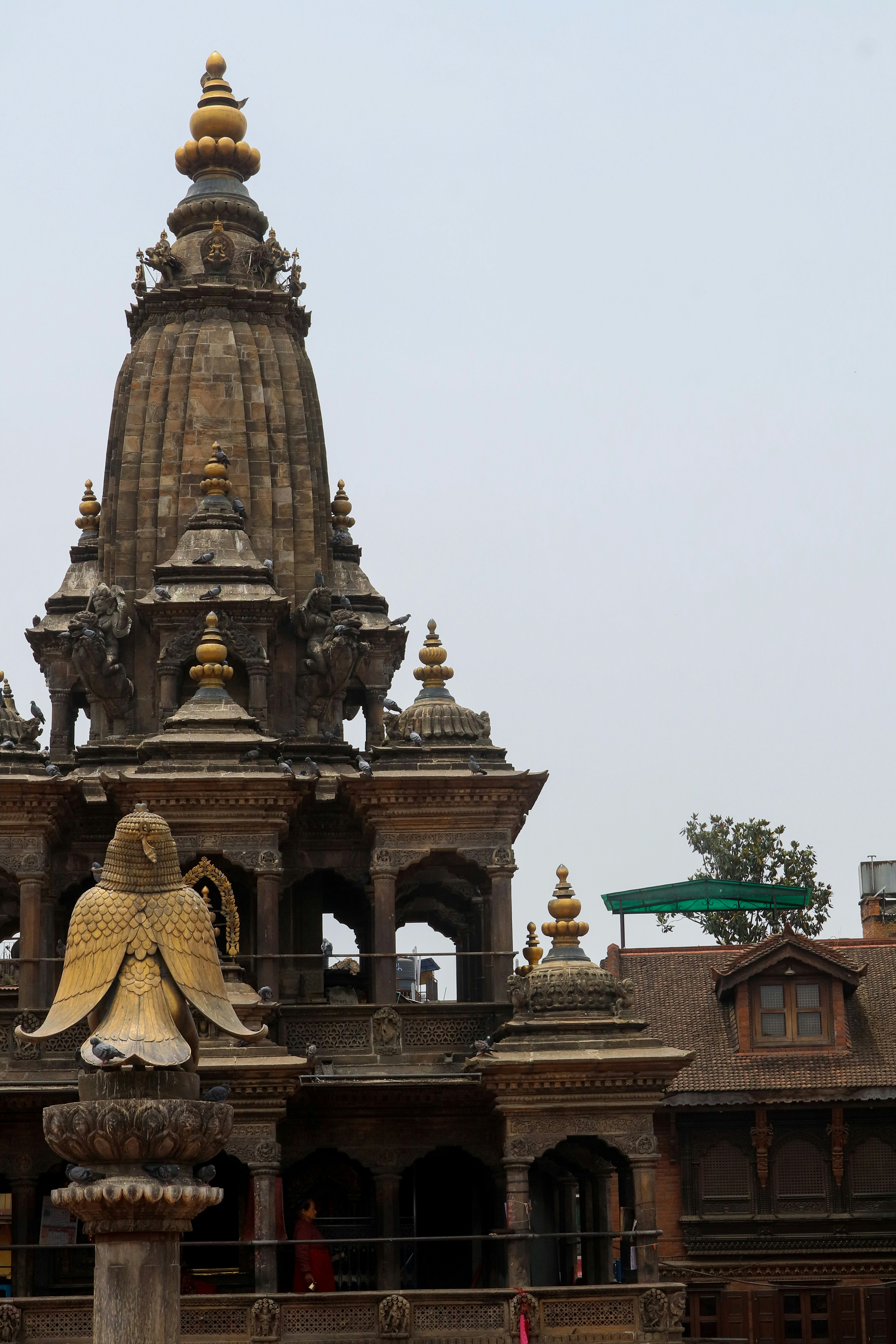a large building with a statue in front of it