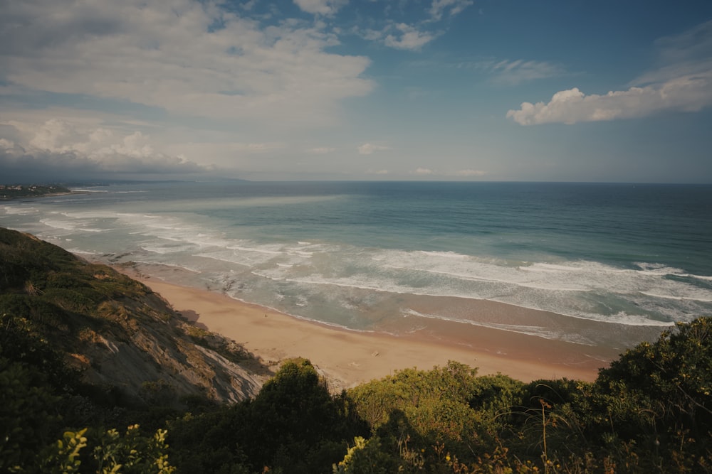 a view of the ocean from a hill