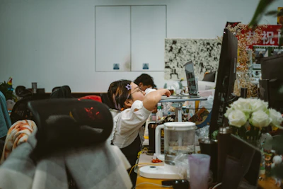 a man and a woman are looking at a computer screen