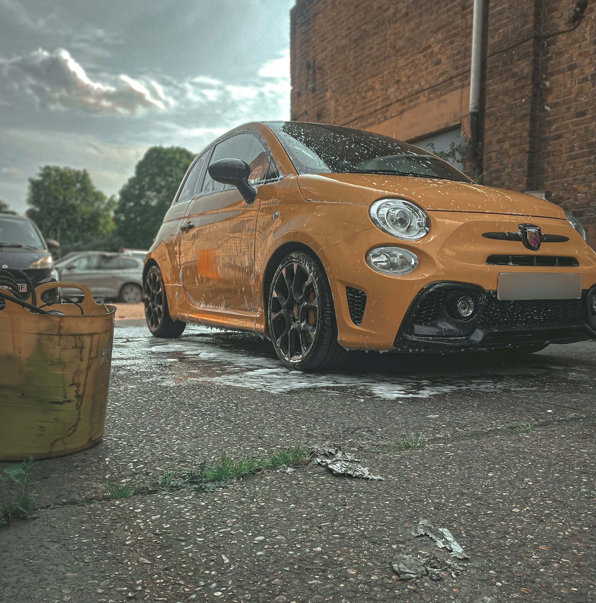 woman wearing yellow long-sleeved dress under white clouds and blue sky during daytime