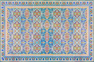 a blue and red rug with an intricate design