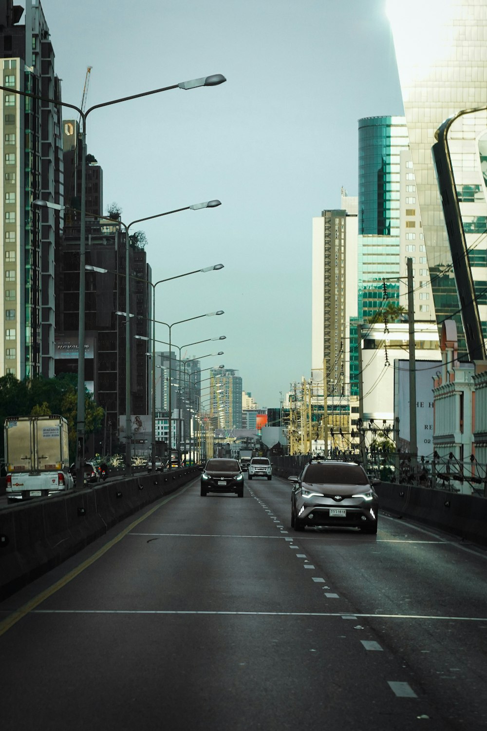 a city street filled with lots of tall buildings