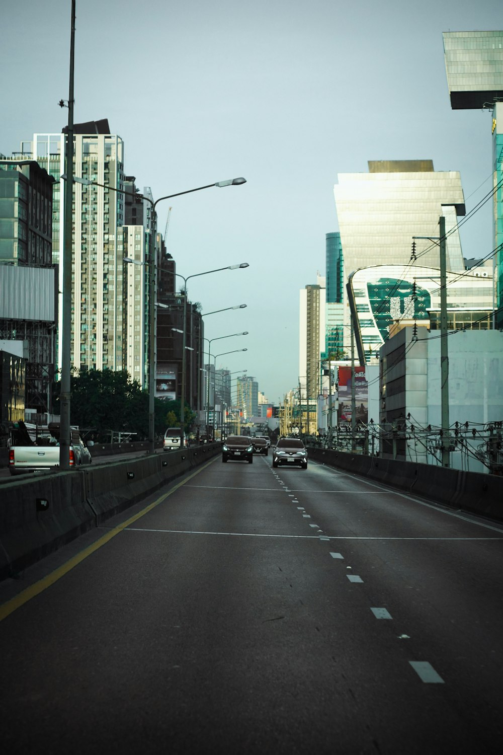 a city street filled with lots of tall buildings