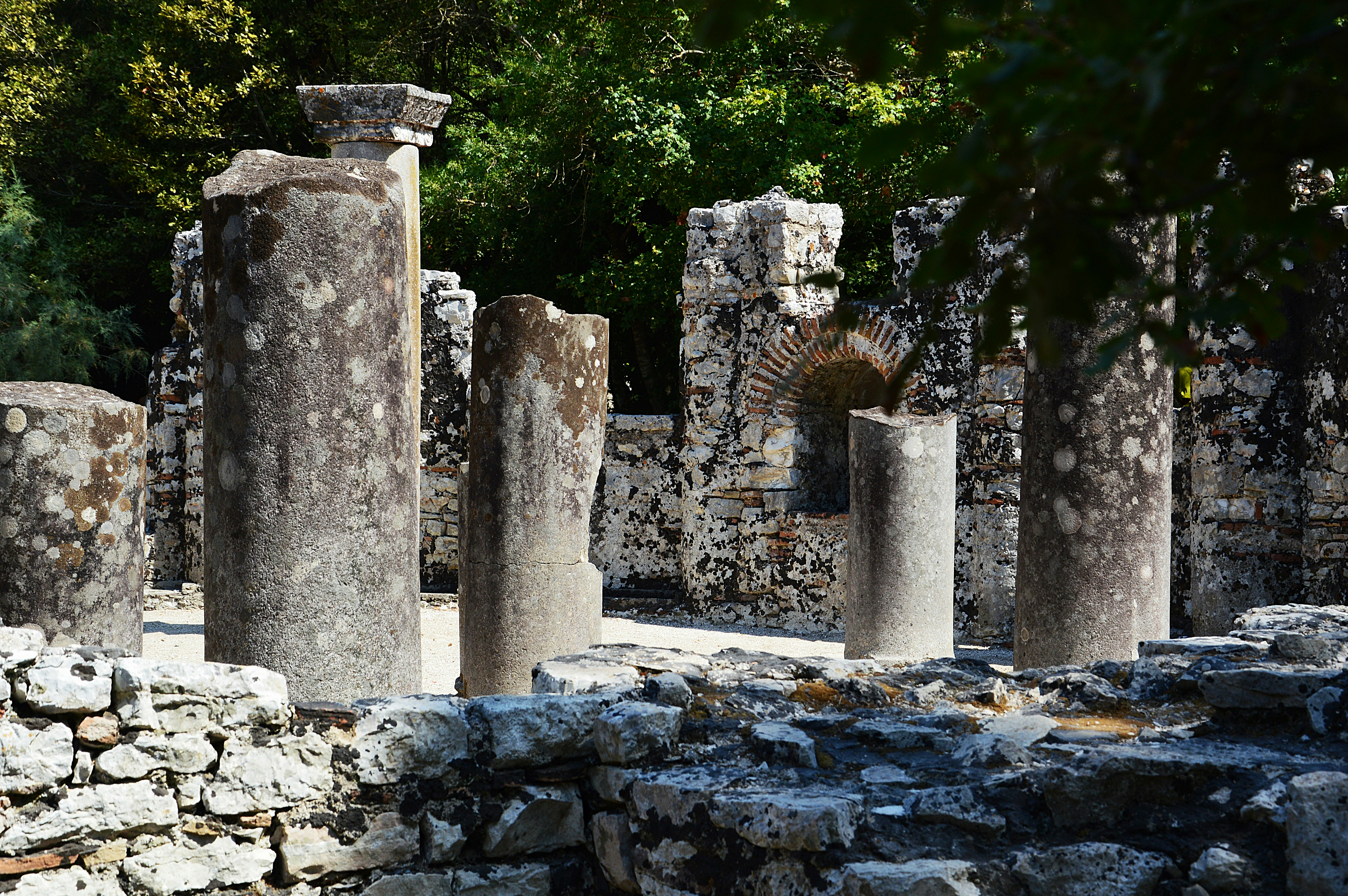 a number of stone pillars near one another, 