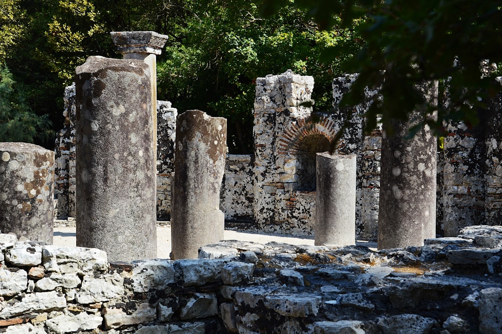 a number of stone pillars near one another