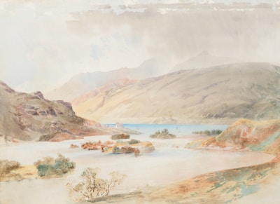 A watercolor landscape featuring a serene lake bordered by mountainous terrain. Small islands with sparse foliage dot the water, and a faint view of distant hills is visible through a misty atmosphere. A few isolated bushes and rocky outcrops grace the shoreline, highlighting the tranquil and natural setting.