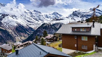 A cozy vacation home under construction with the majestic Himalayas in the distance.