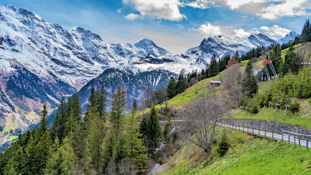 a scenic view of a mountain with a road going through it