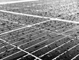 A before and after comparison of solar panel cleanliness.